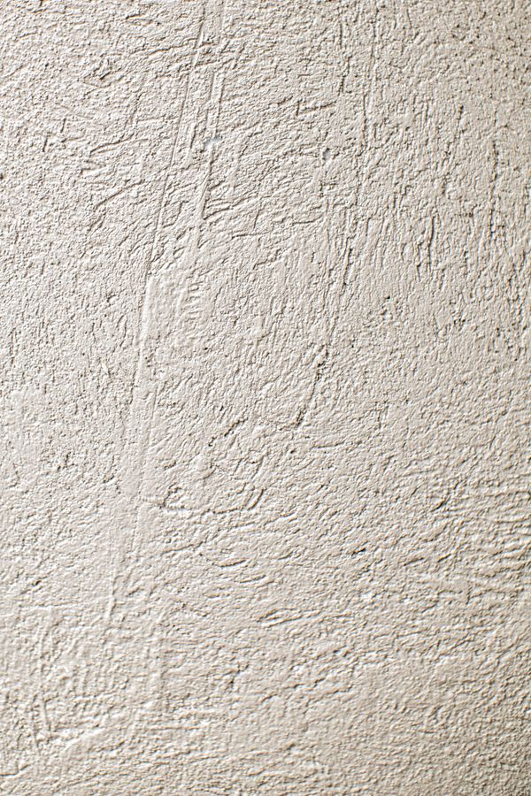Filzputz: fein geriebene, gleichmäßige Oberfläche in Nahaufnahme